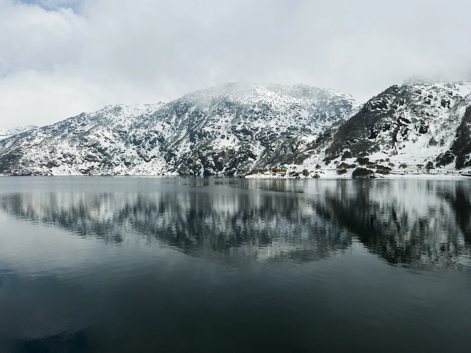 Snowy mountains reflected in Tsomgo Lake
